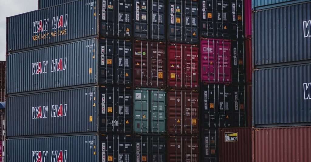 High vertical stack of cargo containers at a port, symbolizing global logistics.